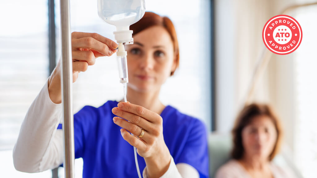 Healthcare professional adjusting IV drip in hospital setting, ATO approved